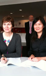 Professor Dorothy Miell and Professor Brenda Yeoh at the signing