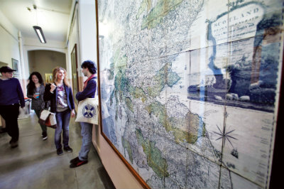 Students standing next to map of Scotland