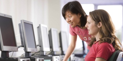 Two female students in the computer lab