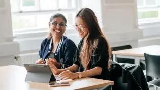 IFP students laughing together in a classroom