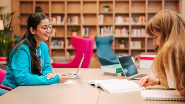 IFP students laughing together while studying