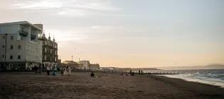 Beachgoers enjoy the midsummer twilight along Portobello promenade.
