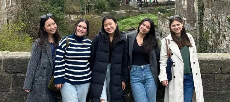 IFP students smiling together on bridge