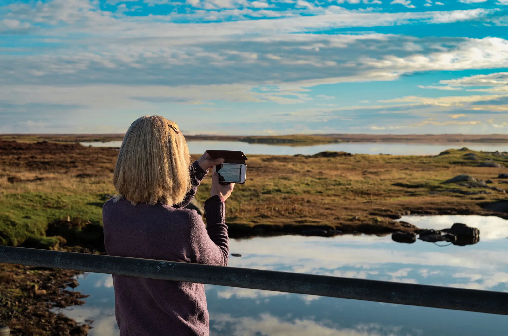 Woman on island with smartphone