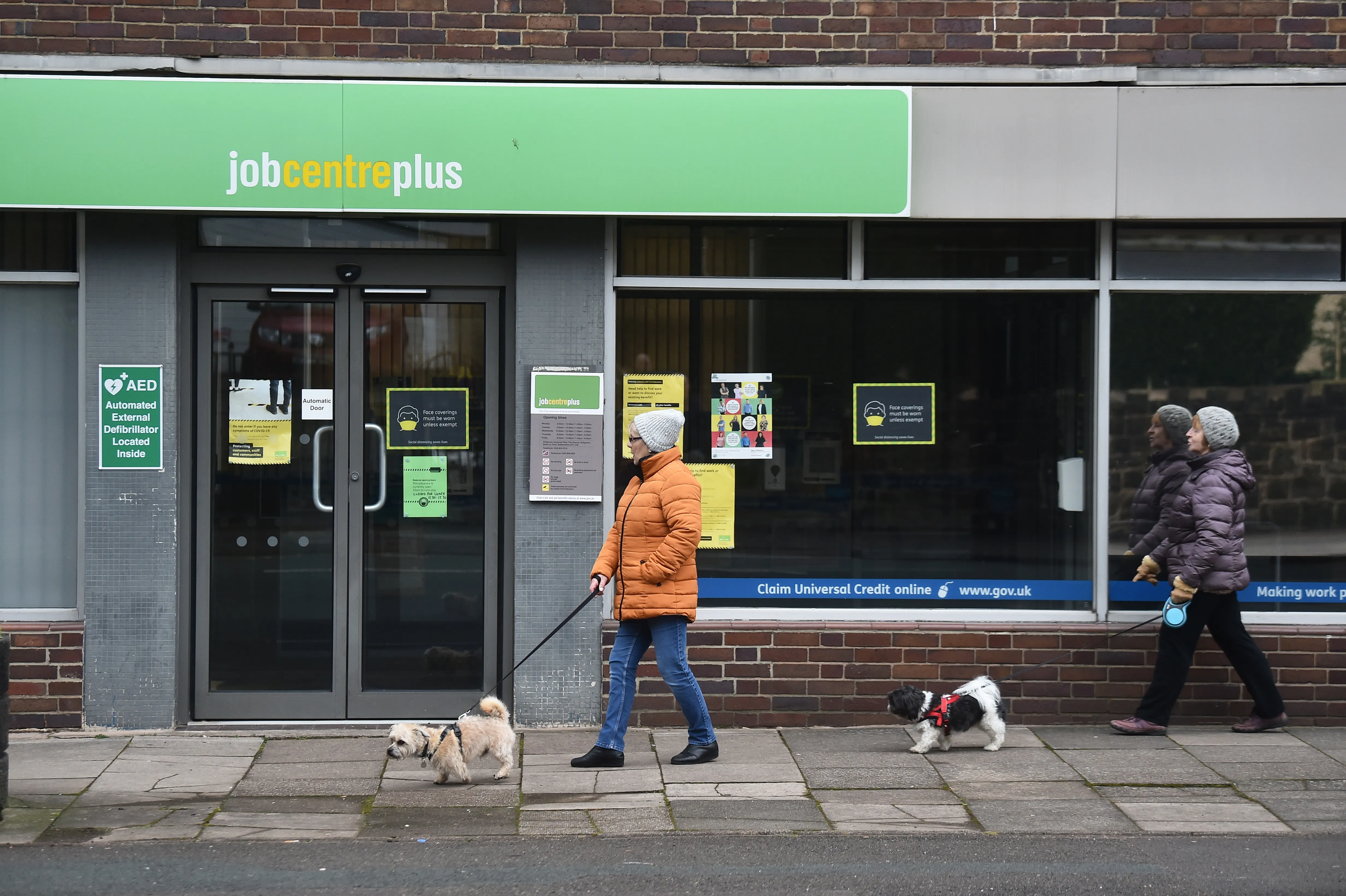 people walking outside a job centre