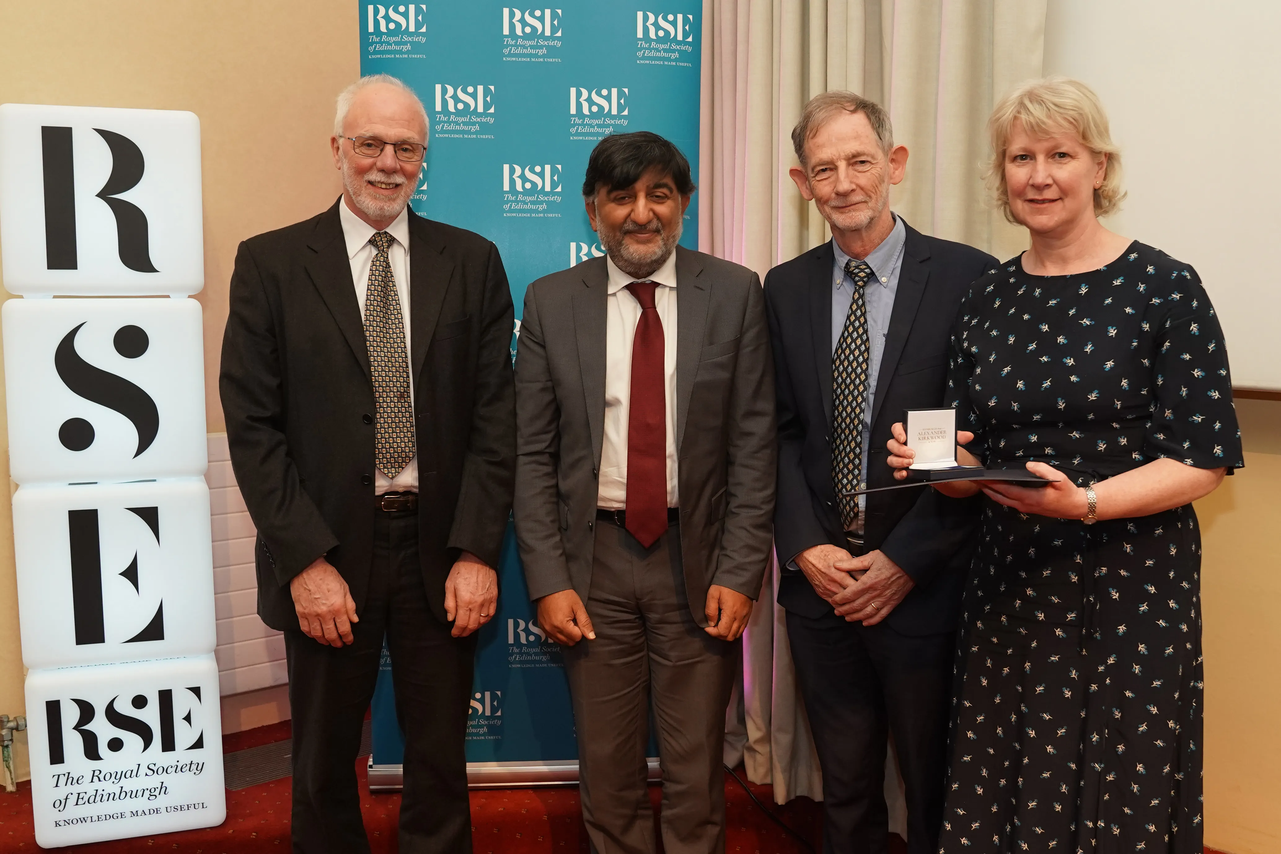 Group of four academics