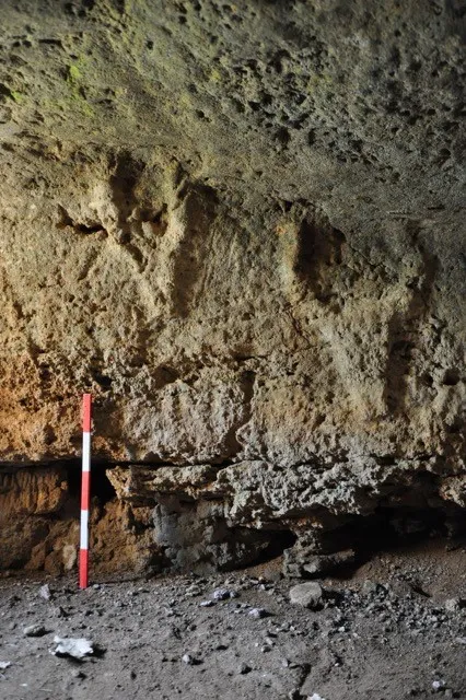 Carved cattle heads in a rock-cut tomb in Anghelu Ruju, Sardinia (Italy).