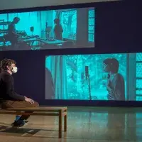 Gabrielle Goliath. This song is for ...  Projection with dual stereo audio. Pictured – James Clegg, Curator at Talbot Rice Galle