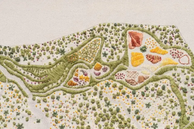 Piece of embroidery by Larry Huo, which aims to educate people about soil and how it can address the climate crisis.