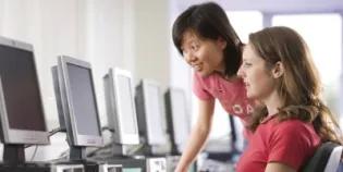 Two female students in the computer lab